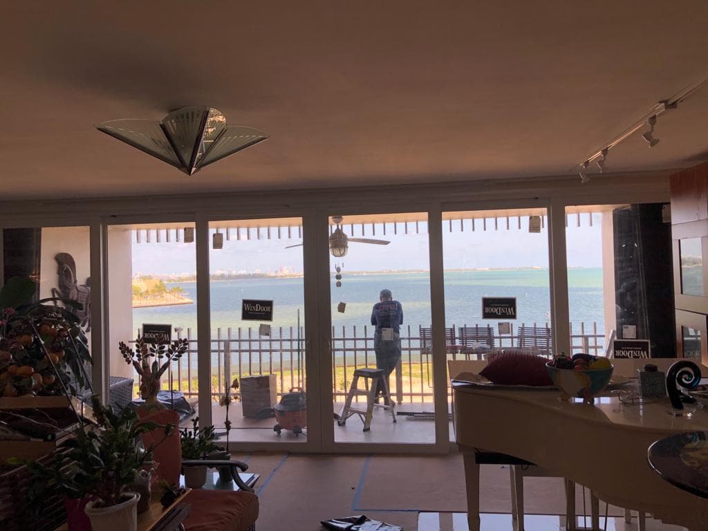Custom designed hurricane impact windows installed on a Mediterranean style home in Coral Gables Florida preserving historic architectural character