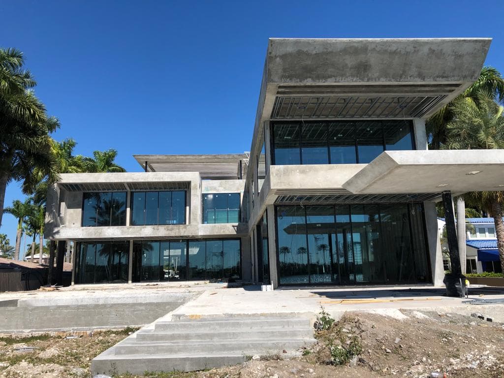 Hurricane impact rated glass door installed on a home in Hollywood Broward County Florida with reinforced frame and hardware