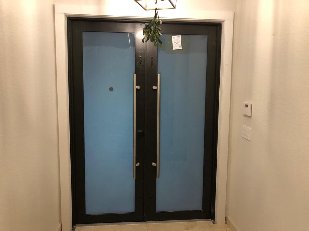 Large fixed impact picture window installed in West Palm Beach Florida with Low-E insulated glass providing panoramic views and UV protection
