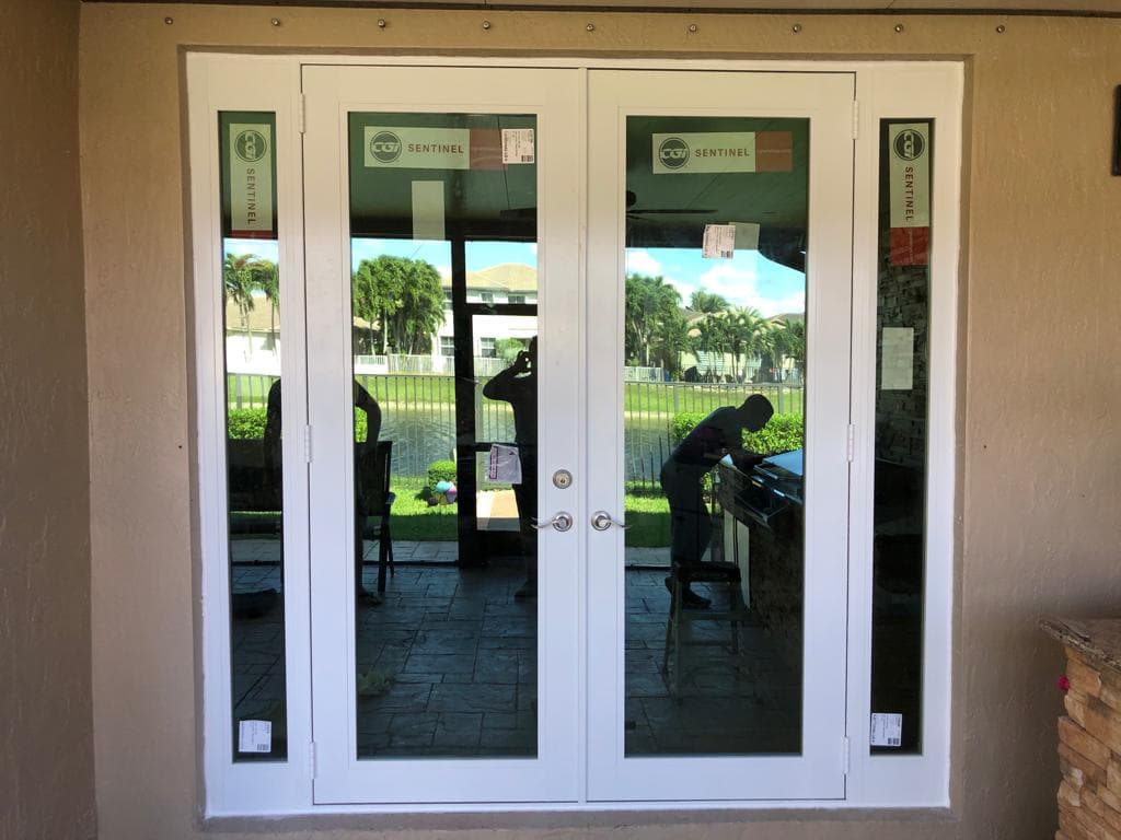 Impact entry doors with multi-point locking systems installed on a home in Miami Florida providing enhanced security and hurricane protection