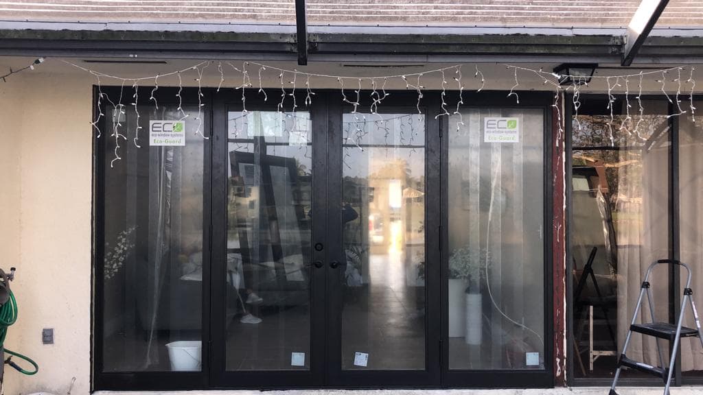 Noise reducing impact windows installed on a Florida home near busy roads demonstrating sound insulation with laminated glass technology