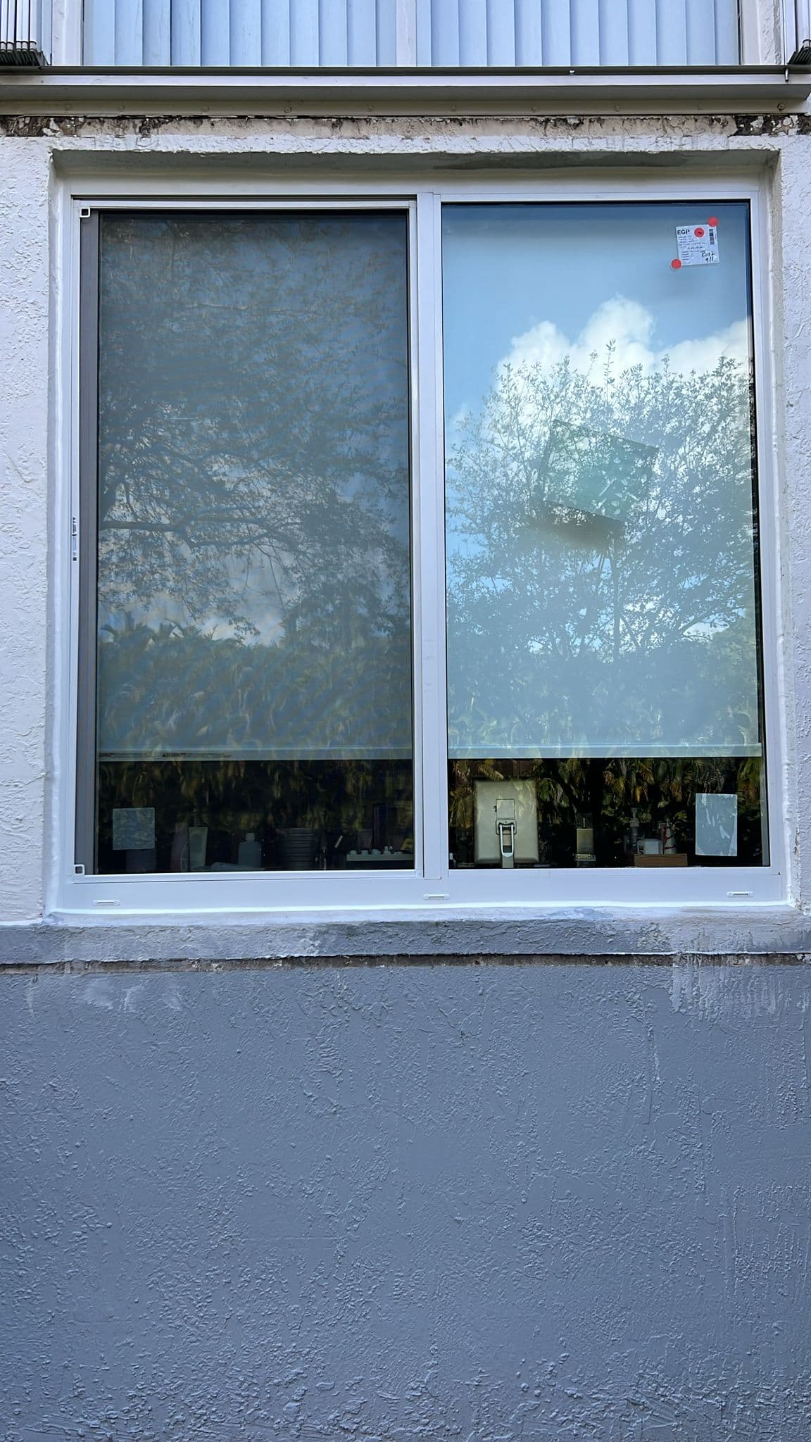 Final result photo of completed impact window installation project on a Florida home showing dramatic improvement and hurricane protection