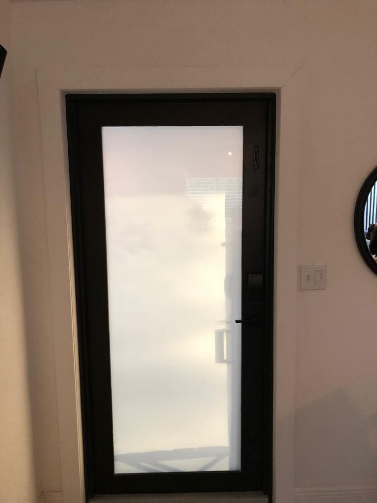 Real on-site photo of impact window being installed at a Florida property showing installation process and framing detail