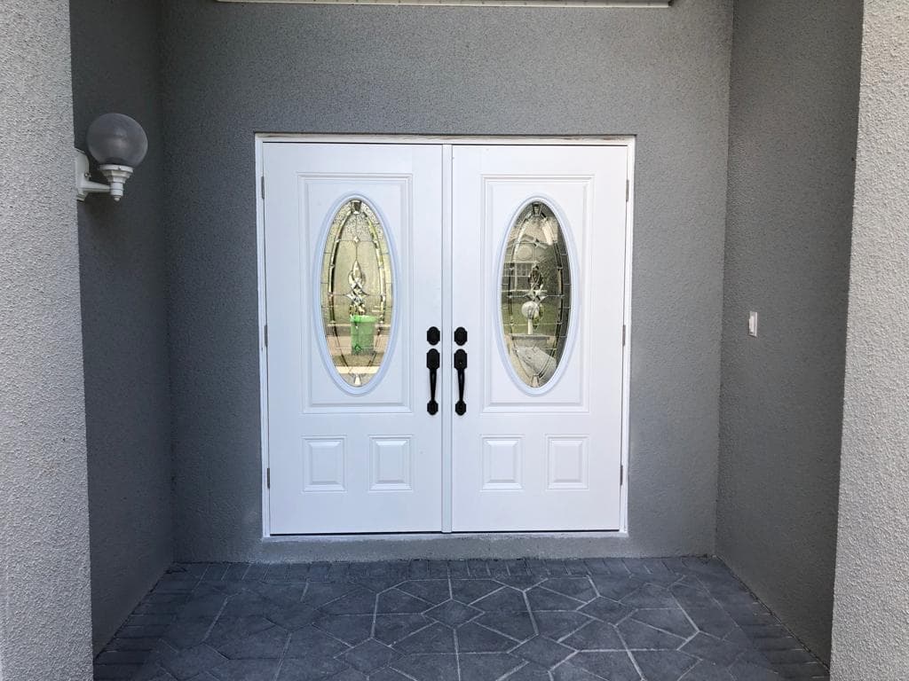 White vinyl impact windows installed on a modern home in Doral Florida with reinforced frames and energy efficient glass